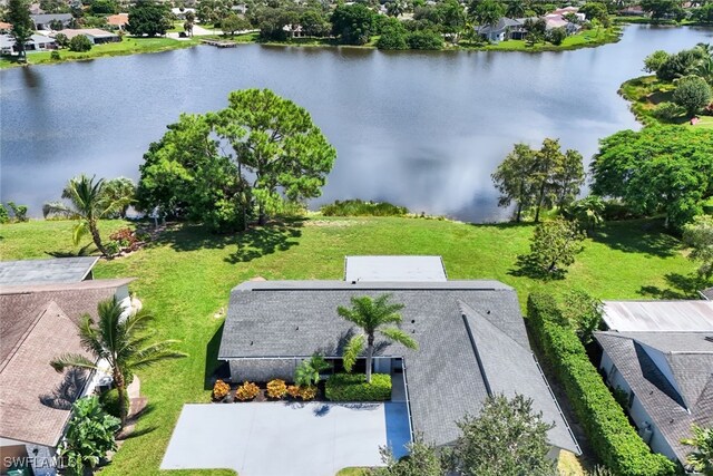 birds eye view of property featuring a water view