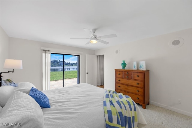 carpeted bedroom with ceiling fan and access to exterior