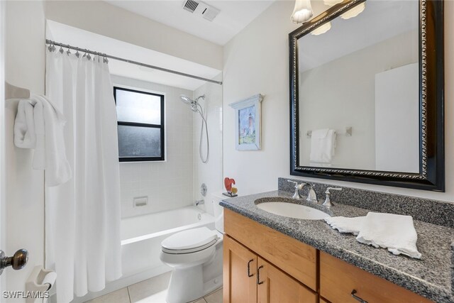 full bathroom with vanity, tile patterned flooring, toilet, and shower / bathtub combination with curtain