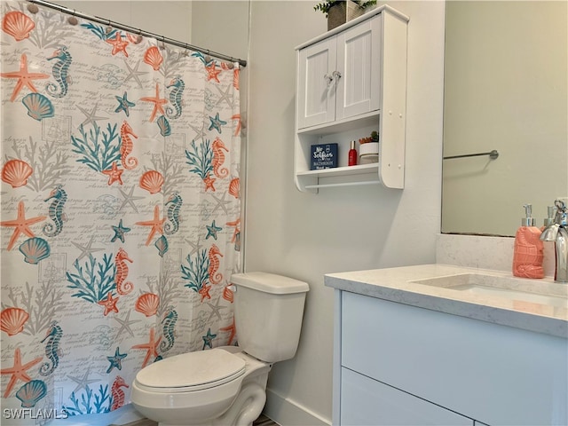 bathroom featuring vanity, toilet, and a shower with curtain