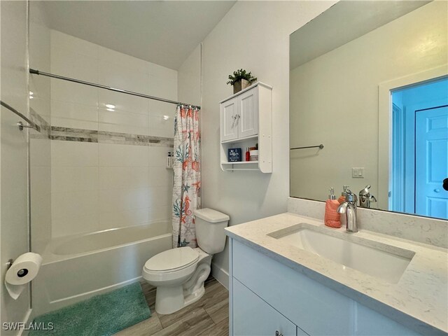 full bathroom with vanity, toilet, hardwood / wood-style floors, and shower / bath combination with curtain