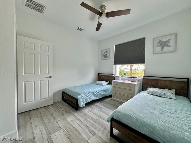 bedroom featuring ceiling fan and light hardwood / wood-style floors