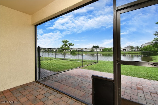 unfurnished sunroom with a water view