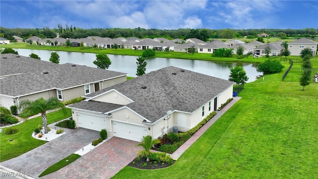 bird's eye view featuring a residential view and a water view