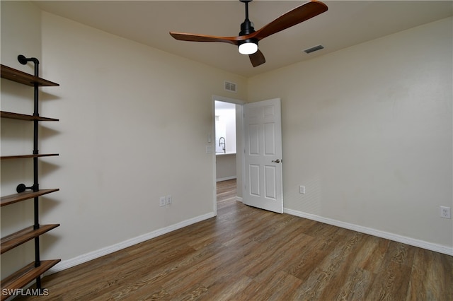 unfurnished room with ceiling fan and light wood-type flooring