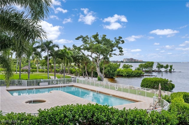 view of swimming pool with a water view