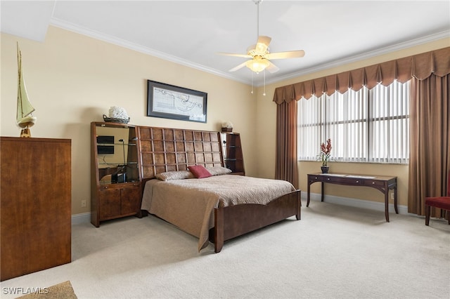 bedroom featuring light carpet, ornamental molding, a ceiling fan, and baseboards