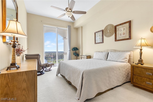 bedroom with light carpet, access to outside, and ceiling fan