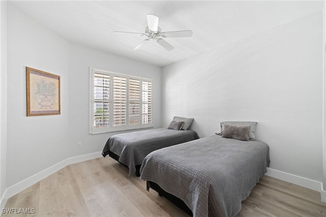 bedroom featuring ceiling fan and light wood-type flooring