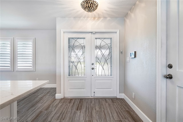 foyer entrance with hardwood / wood-style floors