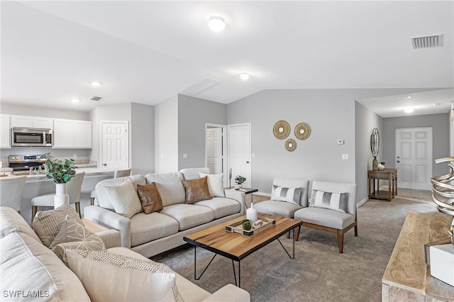 living room with light colored carpet and lofted ceiling