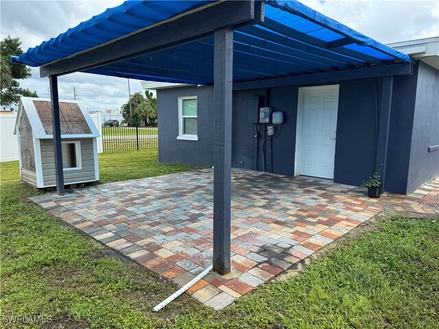 view of patio with a shed