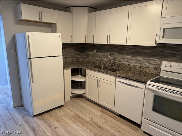 kitchen with light hardwood / wood-style flooring, white cabinets, white appliances, and sink