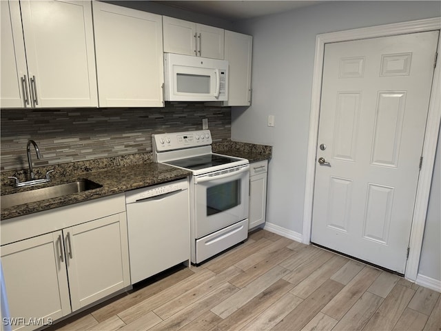 kitchen featuring white appliances, light hardwood / wood-style flooring, sink, and white cabinets