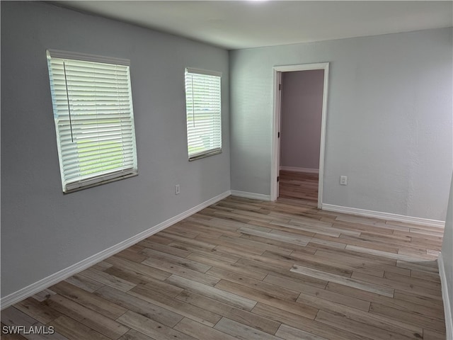 empty room with light hardwood / wood-style floors