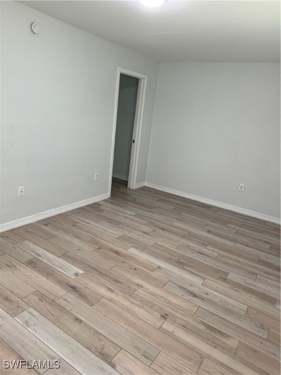 spare room featuring light hardwood / wood-style flooring