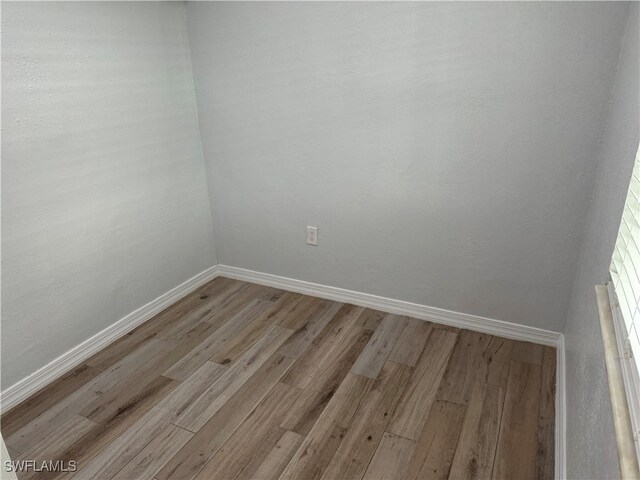 unfurnished room featuring light hardwood / wood-style floors