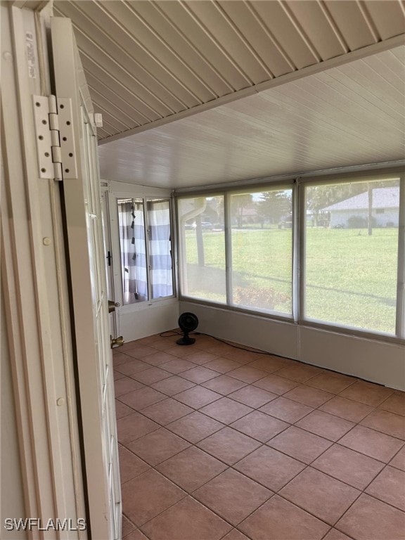 unfurnished sunroom with plenty of natural light