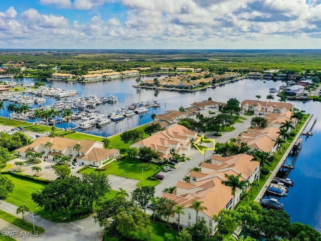 birds eye view of property with a water view