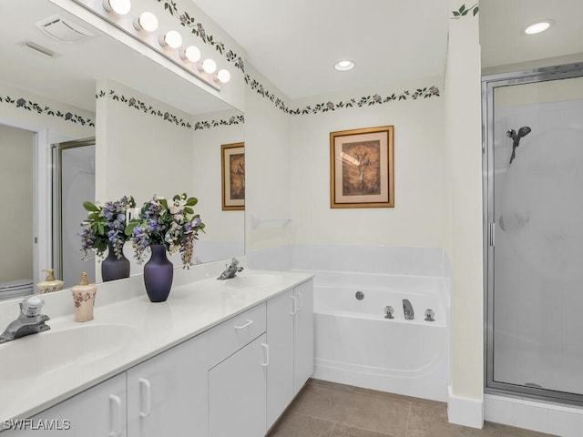 bathroom featuring vanity, independent shower and bath, and tile patterned floors