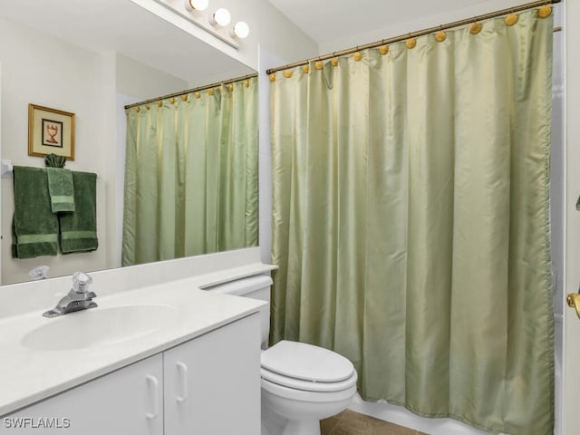 bathroom featuring tile patterned flooring, vanity, toilet, and a shower with curtain