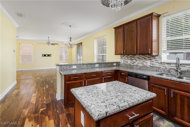 kitchen featuring a kitchen island, ceiling fan with notable chandelier, stainless steel dishwasher, dark wood-type flooring, and sink