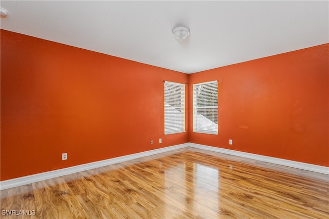 spare room featuring hardwood / wood-style flooring