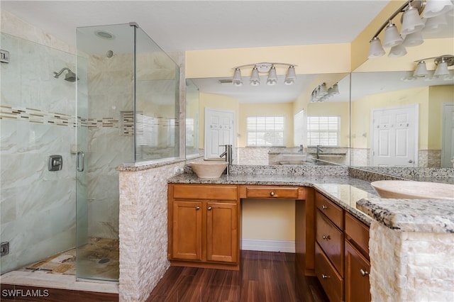 bathroom with vanity, hardwood / wood-style floors, and an enclosed shower