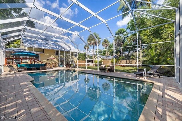 view of pool featuring a patio area and a lanai