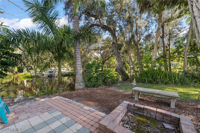 view of patio with a water view