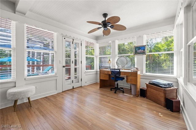 office space with ornamental molding, light wood-type flooring, and a wealth of natural light