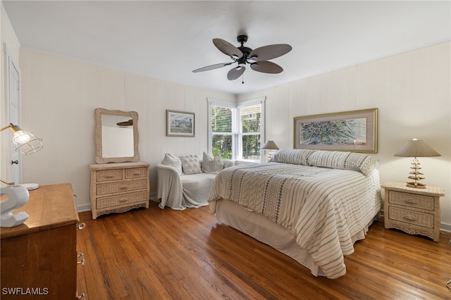 bedroom with hardwood / wood-style flooring and ceiling fan