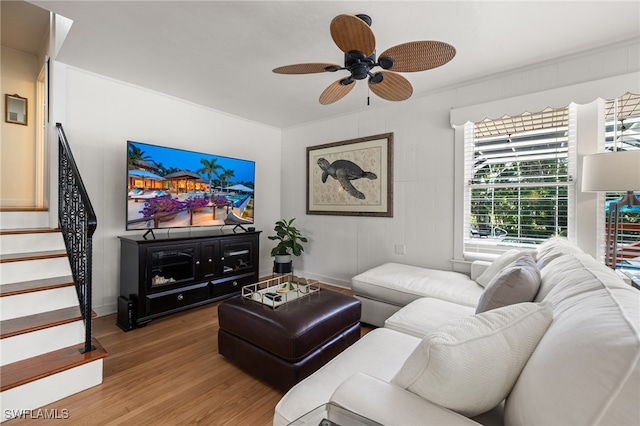 living room featuring ceiling fan and hardwood / wood-style flooring