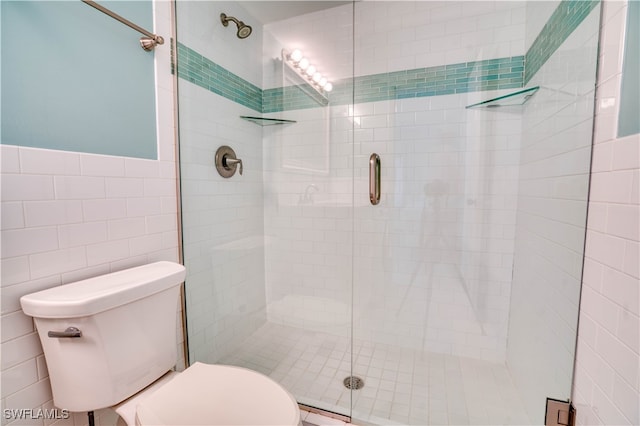 bathroom featuring tile walls, toilet, and walk in shower