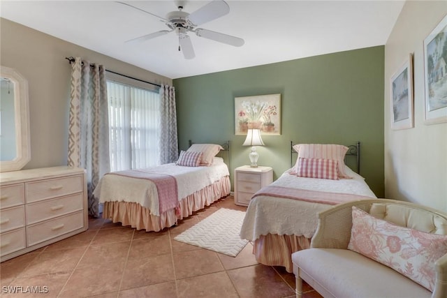 tiled bedroom with ceiling fan