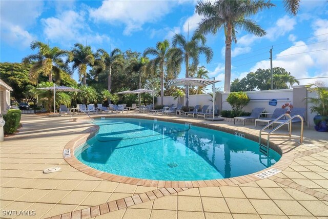 11745 Quail Village Way, Naples, FL 34119 - community pool with a patio