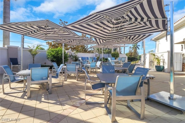 11745 Quail Village Way, Naples, FL 34119 - fenced backyard featuring outdoor dining area and a patio area