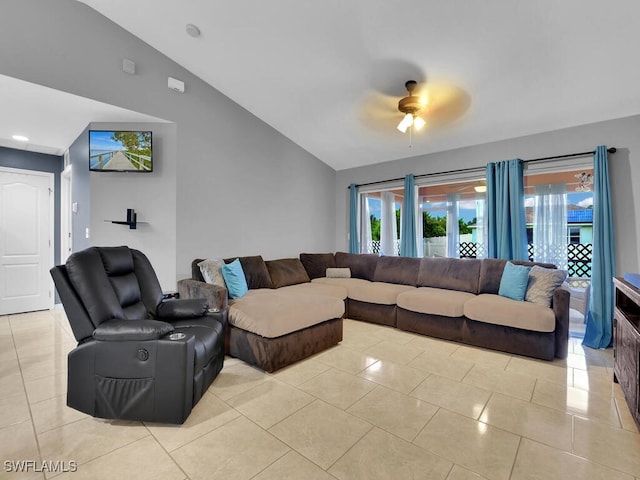 living room with lofted ceiling, light tile patterned floors, and ceiling fan