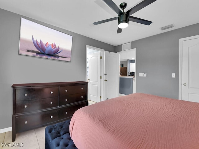 bedroom featuring ceiling fan and light tile patterned flooring