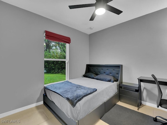 tiled bedroom with ceiling fan