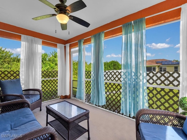 sunroom with ceiling fan and a healthy amount of sunlight