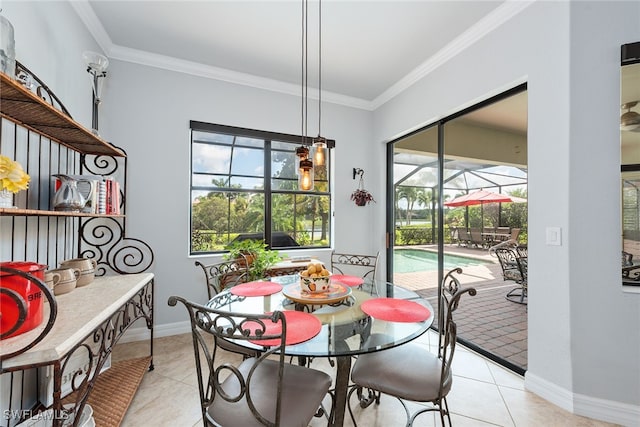 tiled dining room with crown molding and plenty of natural light