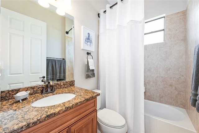 full bathroom with vanity, shower / bath combo, and toilet