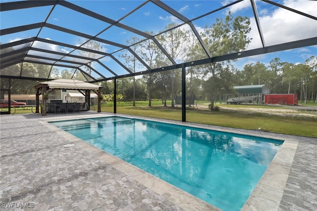 view of pool featuring a lawn, a lanai, a gazebo, and a patio area