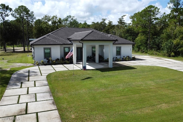 62 35th Ave NE, Naples, FL 34120 - rear view of house with a yard