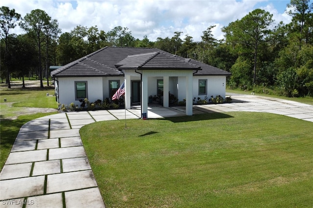 rear view of house with a yard