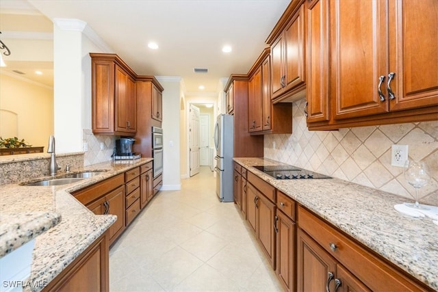 kitchen featuring light stone countertops, stainless steel appliances, decorative backsplash, crown molding, and sink