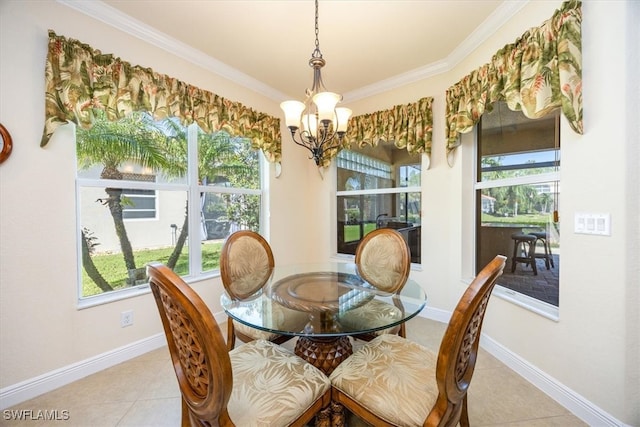 tiled dining space featuring a chandelier and ornamental molding