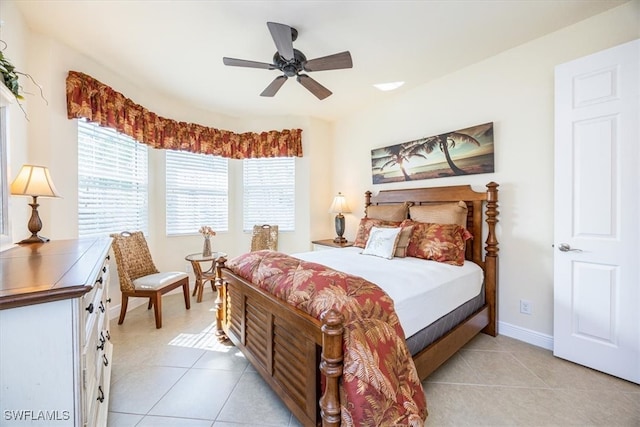 bedroom with ceiling fan and light tile patterned floors