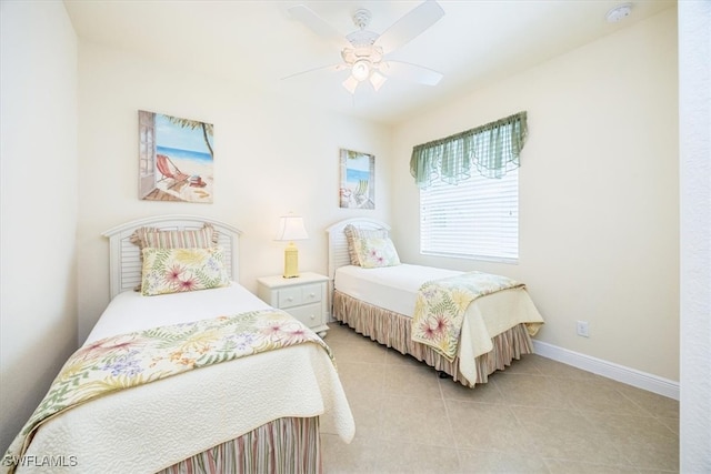 tiled bedroom featuring ceiling fan